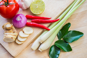 ingredients of TomYam spicy soup on wooden table.