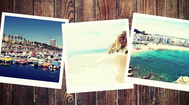Vintage photos from summer holiday with traditional white frame placed on wooden desk.