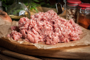 Minced meat on wooden background.