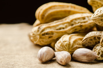 Boiled peanuts or groundnuts in a bowl on wooden background ready to eating