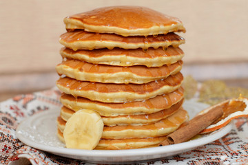 Well baked pancakes are topped with honey for an extra taste. These pancakes are the one of American meals.