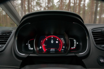 Speedometer, tachometer and odometer. Modern car dashboard.