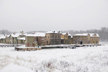 Fototapeta na wymiar The buildings of the medieval city in winter