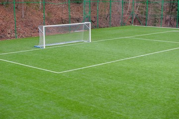corner in the football field with artificial turf flag