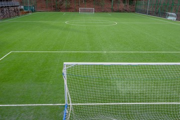 corner in the football field with artificial turf flag