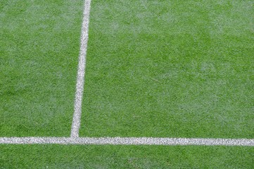 corner in the football field with artificial turf flag