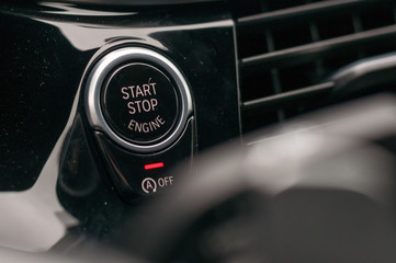 Engine start and stop button in the car.