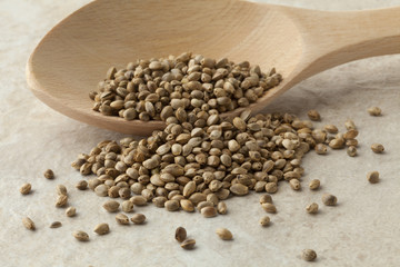 Hemp seeds on a wooden spoon