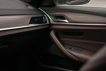Luxury car interior. Leather and wood.