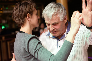 Man dancing with his daughter