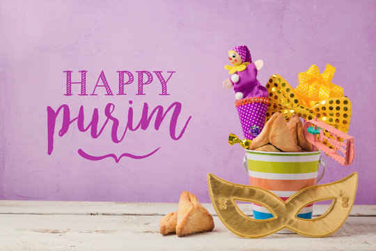 Purim holiday greeting card with carnival mask and gifts over purple background