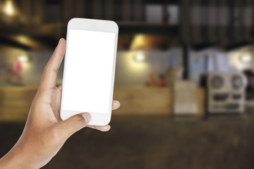 hand with smartphone in a counter bar at hotel.