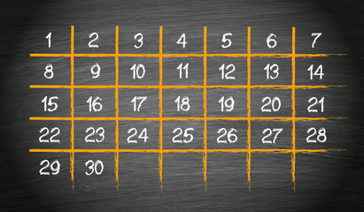 Monthly Calendar with 30 days on chalkboard background
