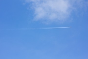 Airplane in the blue sky.