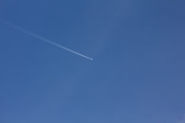 Airplane in the blue sky.