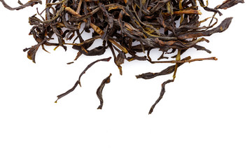 pile of raw chinese tea isolated on white