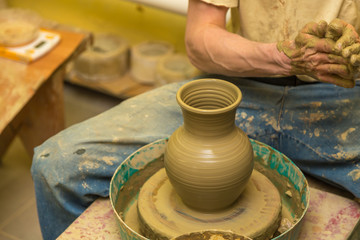 potter makes earthen vessel