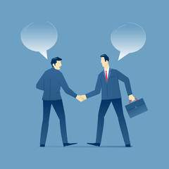 Two businessmen shake hands in business agreement