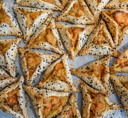 Hamantaschen cookies with sweet potato  at the bakery display for Purim Celebration.