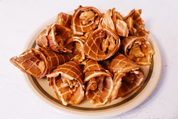 Homemade waffles with condensed milk. Traditional Russian dessert
