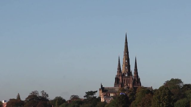 Tilt Down Beautiful View of Lichfield Cathedral Over Stowe Pool - Beautiful Morning Light in a Blue Sky