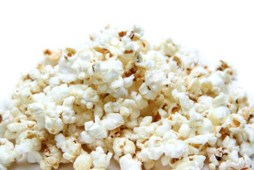 Popcorn pile on white background close-up.