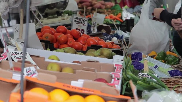 Transaction At A Farmers Market Vegetable Stand in Lichfield