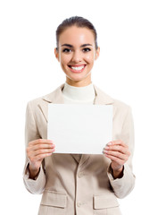 Fototapeta premium Happy young businesswoman showing blank signboard with copyspace area for slogan, text or advertisiment, isolated on white background. Business success concept.