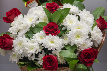 Bunch of large white chrysanthemums and red roses