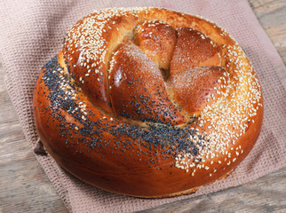 Wheat loaf with poppy seeds. Closeup top view