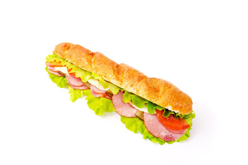 long sandwich with tomatoes and juicy sausage on a white background