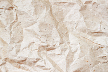 Rumpled environmental or craft paper texture background close-up. Grunge old paper surface texture. For modern pattern, wallpaper, banner design. Place for your text