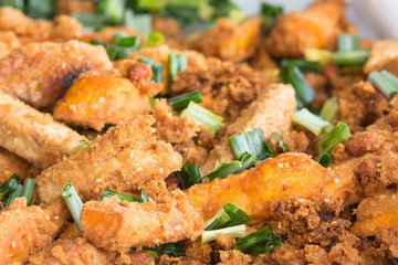 chicken cooked in breadcrumbs with a ruddy crust with the addition of green onions