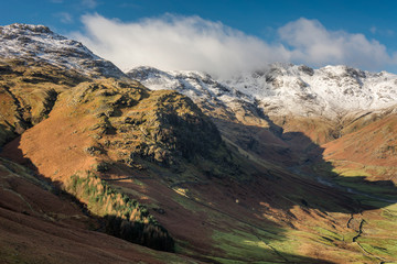 Lake District mountains covered in snow on a sunny winter morning.