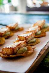 Tostones with abocado and fried cheese