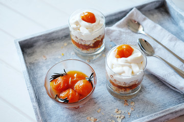 Oats layered with spicy and sweet apricot jam. Healthy food concept.