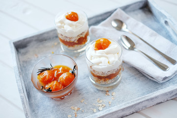 Oats layered with pricy apricot jam serived for breakfst. Healthy food concept.