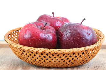 Fresh red apples with water drops closeup