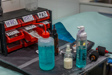 Close-up of different tools used to make a tattoo