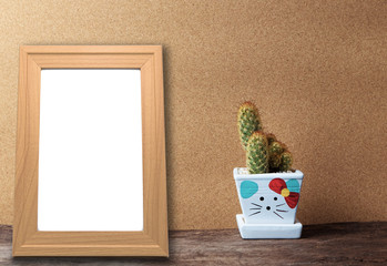 blank wooden frame mockup with basket of chamomile flowers