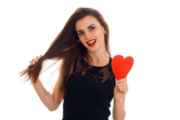 beautiful girl with long hair holding a red heart
