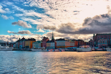 Antique European house on the bay at sunset, Stockholm