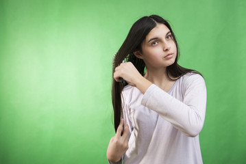 Fototapeta premium teen girl comb hair