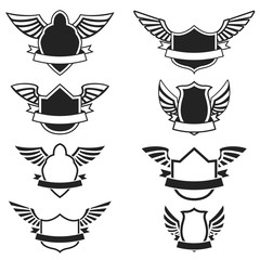 Set of the empty emblems with wings. Design elements for logo, label, badge, sign. Vector illustration