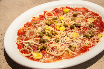 Salmon Carpaccio in a white plate