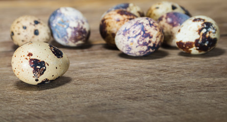 Boiled partridge eggs lay on bamboo mat