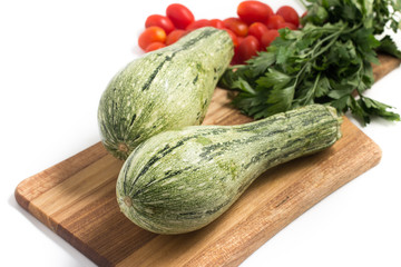 Zucchini over a wooden board