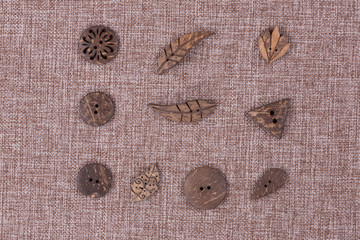 collection of wooden buttons, background burlap