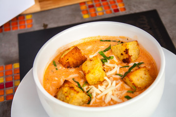 Cream of tomato with croutons and condiments