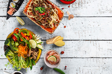 Various of asian meals on rustic background , top view , place for text.